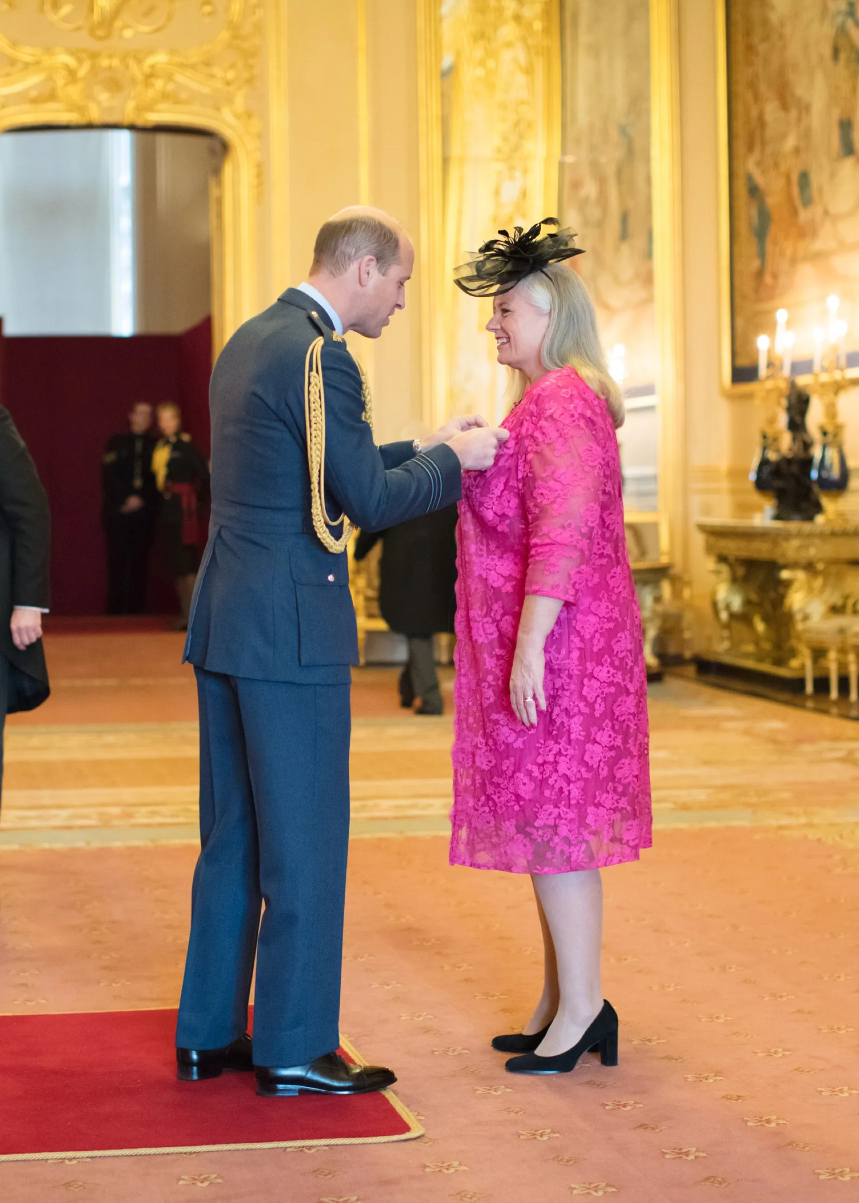 Prince William presenting Alison with her MBE at Windsor Castle.