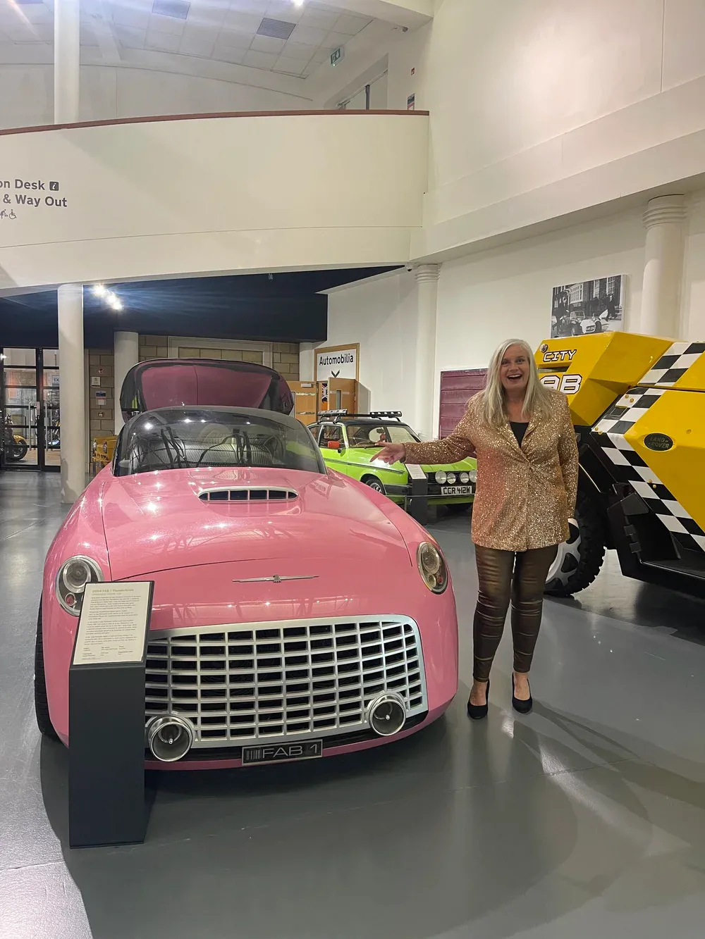 Alison at the British Motor Museum, delighted to find the pink FAB 1.