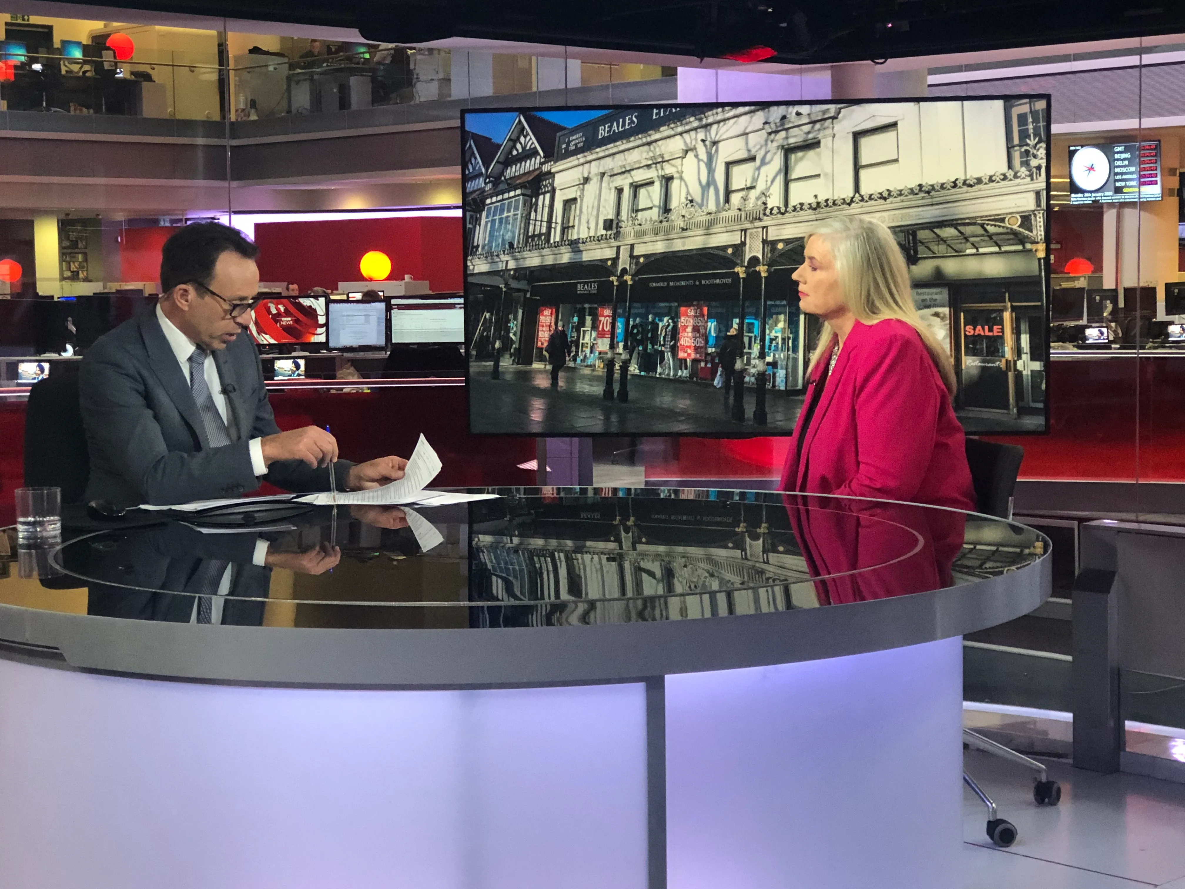 Dr Alison Edgar MBE being interviewed at the desk of the BBC News studio.